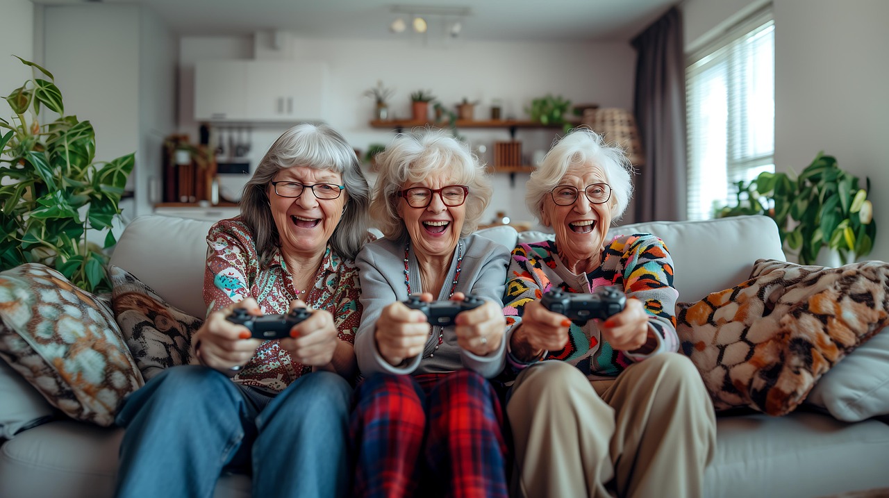Trois retraitées sont dans un salon en train de faire une partie de jeu vidéo. Elles s'amusent comme des folles